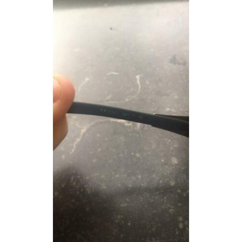 Rayban zonnebril in Nieuwstraat