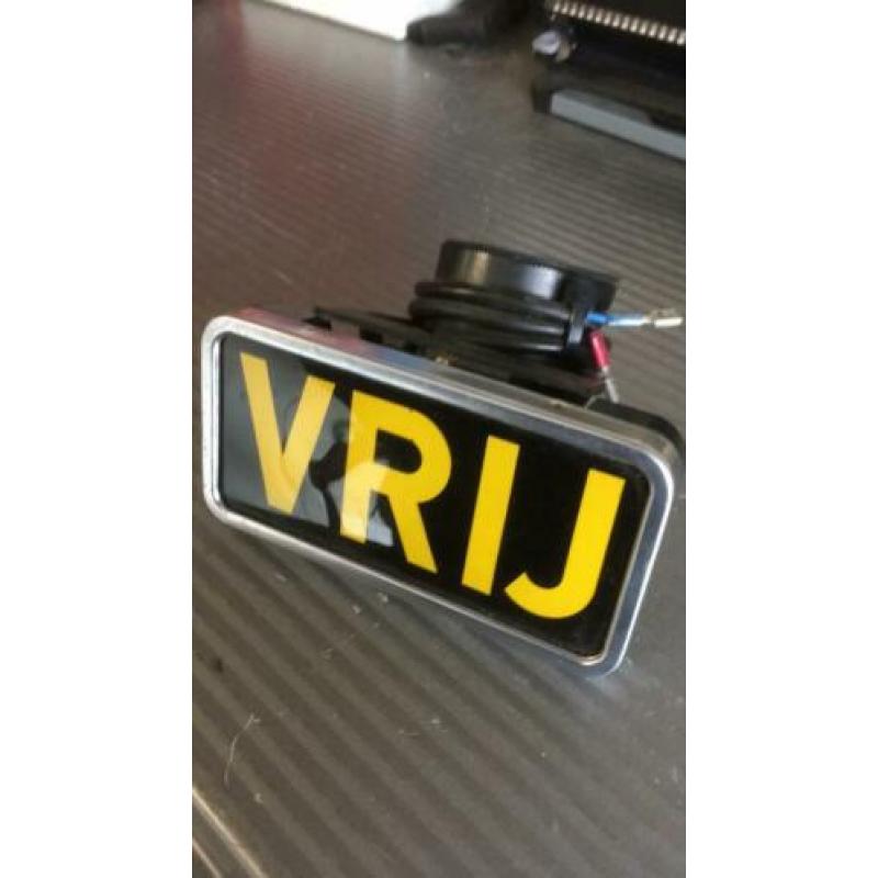 Oud taxi bordje vrij